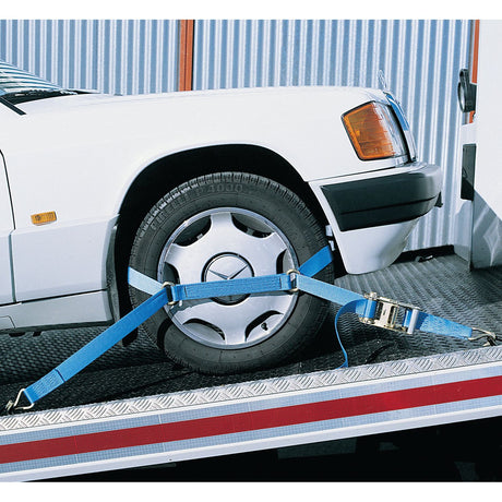 A white car is secured on a trailer with Sparex Bridging Straps 500mm (Part No. S.27037) attached to the front left tire, ensuring it meets product specifications.