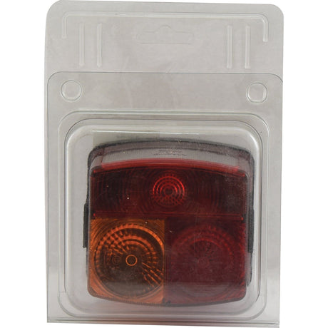 A Sparex Rear Combination Light (Halogen) for the right-hand side, featuring brake, tail, indicator, and number plate functions for 12/24V vehicles, is displayed in a clear plastic container with a hanging tab.