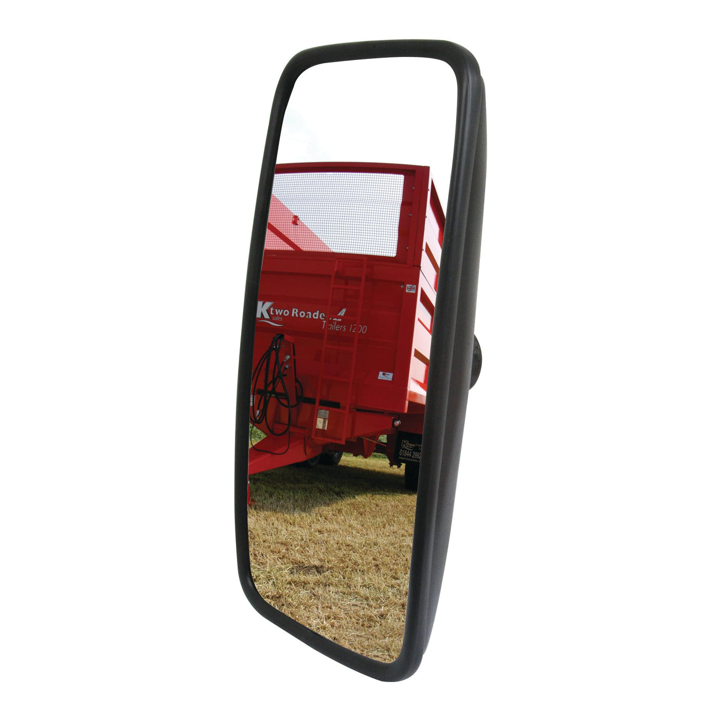 A "Mirror Head - Rectangular, Convex, 420 x 220mm, RH & LH - S.27620" from Sparex captures the reflection of a red Case IH agricultural trailer against a backdrop of dried grass.