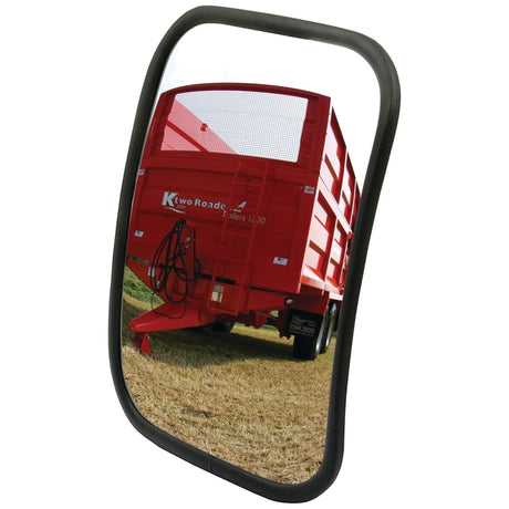 Reflection of a red agricultural trailer in a Sparex Mirror Head - Rectangular, Convex - Wide Angle (320 x 235mm, RH & LH - S.27621), showing the trailer's rectangular shape rear view, parked on a grassy field.