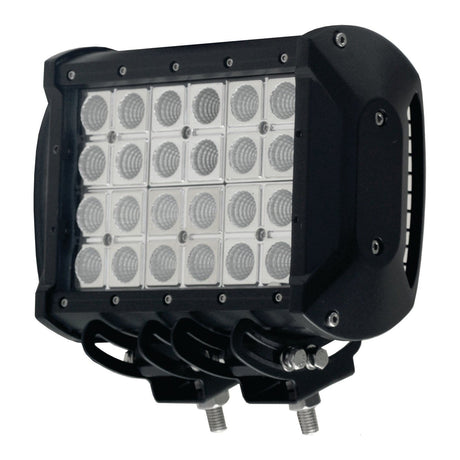 A close-up of the Sparex LED Work Light, model S.28770, reveals a rectangular light bar with numerous small, circular LED lights arranged in a grid pattern. These LEDs are housed within a sleek black casing and come equipped with mounting brackets on the bottom. Emitting 7200 raw lumens and operating within a 10-30V range, this well-crafted device is suitable for various applications and showcases detailed manufacturing information.