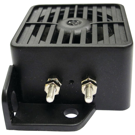 The Sparex S.28894 Reversing Alarm features a black rectangular design with a vented top and two metal connector posts at the bottom, making it suitable for mounting on a bracket with a single mounting hole.