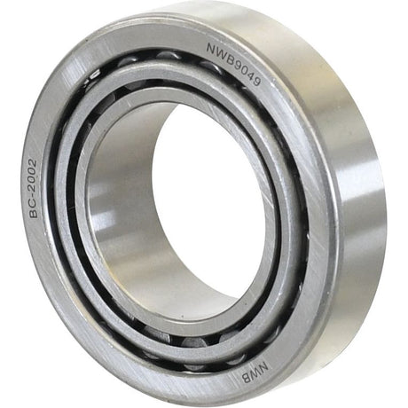 Close-up of a Sparex Taper Roller Bearing (25590/25520) - S.2976 with the labels "BC-2002" and "NWB9049" engraved on its surface. Suitable for applications requiring smooth rotational movement, the bearing has multiple inner and outer rings. Manufacture information is available upon request.