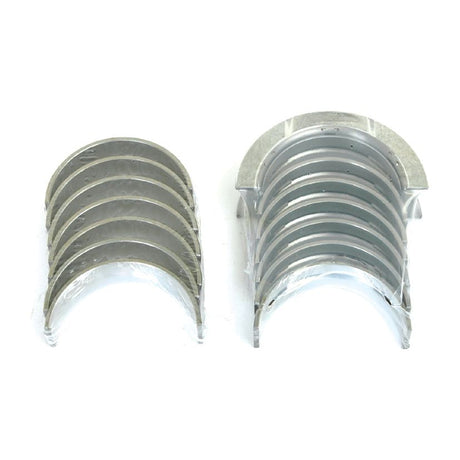 Two sets of engine bearings, one with seven pieces and the other with six, arranged side by side on a white background. The precision and quality associated with brands like Sparex are evident in every piece, especially in their Main Bearing Std. (Set) (Sparex Part No.S.30053).