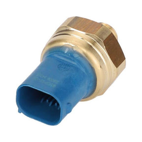 A close-up image of the Massey Ferguson - Pressure Sensor - V837070201 from AGCO, featuring a blue plastic connector and brass metal housing, designed for compatibility with Massey Ferguson Models.