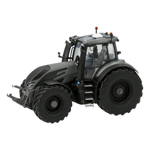 Viewed from a slight angle, the VALTRA Q305 in Titanium Grey by AGCO features large tires, a robust front bumper, and orange lights on the roof. This scale model from Universal Hobbies meticulously captures every detail.