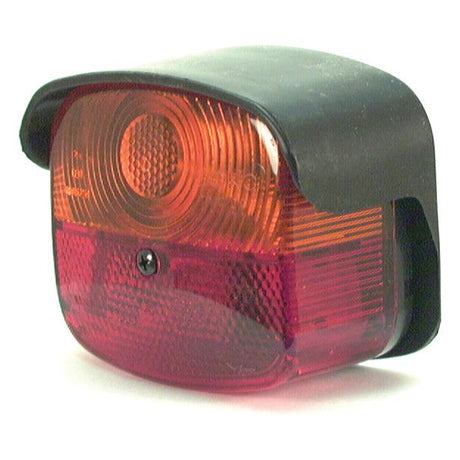 A Sparex Rear Combination Light (Halogen) for the right-hand side, featuring a black casing with circular and rectangular polycarbonate lens patterns in red and orange. This 12V light supports three functions: brake, tail, and indicator. Product code: S.35793.