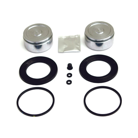 The Brake Caliper Repair Kit | Sparex Part No. S.37305 from Sparex includes two metal pistons, two rubber seals, two O-rings, two dust boots, a small packet of grease, and three small rubber components. It is displayed against a white background and is perfectly compatible with Deutz-Fahr systems.