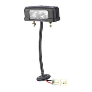 A license plate light with a rectangular lens, detachable wiring harness, and mounting bolts, compatible with Massey Ferguson models, product name "Massey Ferguson - Light, License Plate - 3809543M91" by AGCO.