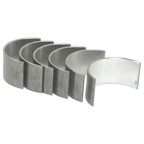 Five metallic, curved bearing shells arranged in a row, reminiscent of high-quality components you'd find in a Massey Ferguson or Allis Chalmers engine—this is the Conrod Bearing +0.010'' (0.25mm) Set by Sparex (Sparex Part No. S.40316).