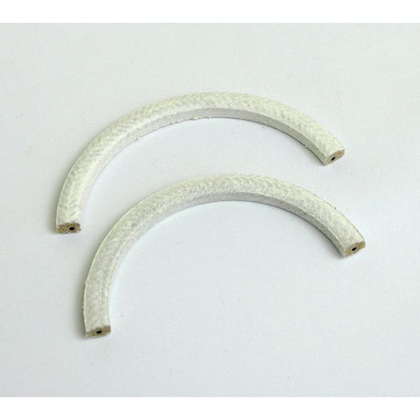 Two white, curved, textured objects rest on a white surface, reminiscent of the Rope Seal Set (2 pcs.) by Sparex, Part No. S.40355 from the Perkins Build List.