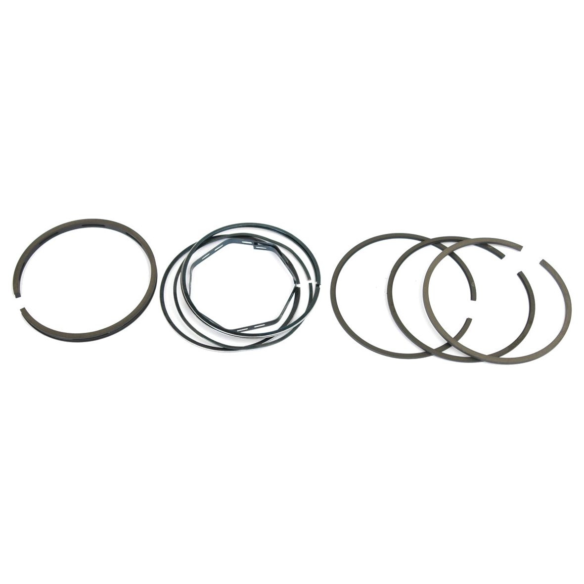 Assorted Sparex piston rings, including the Piston Ring | Sparex Part No. S.40425 compatible with Massey Ferguson and Perkins engines, arranged in a row against a white background.