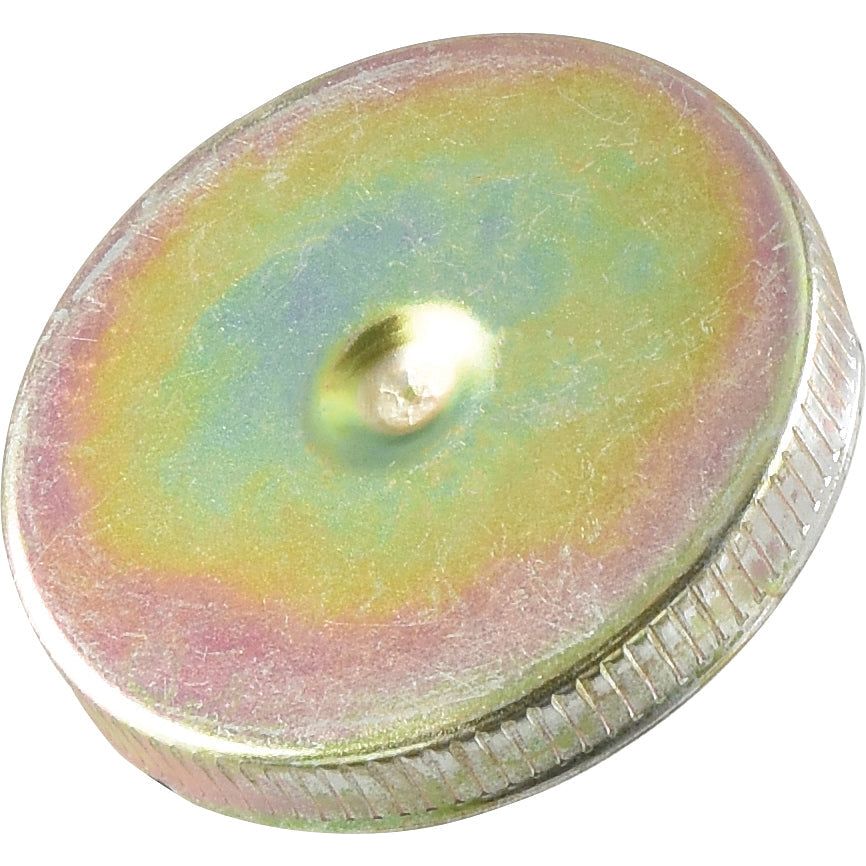 Sparex's Fuel Cap - S.40570 features a round metal disk with a colorful, iridescent surface and a textured edge, resembling a vintage metal seal.