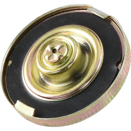 Close-up of the Fuel Cap - S.40570 by Sparex, showcasing a round metal mechanical component with a brass-colored central section, complemented by a vented bayonet and surrounded by a black and silver rim.