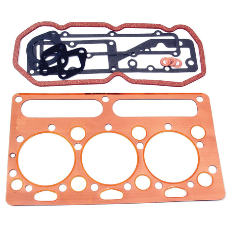 A set of various asbestos-free gaskets, including a copper head gasket with multiple holes and several smaller rubber gaskets, all used in Perkins engine assembly, arranged on a white background. This is the Top Gasket Set - 3 Cyl. (AD3.152, AT3.152.4, AT3.152, A3.144) by Sparex (Sparex Part No.S.40589).