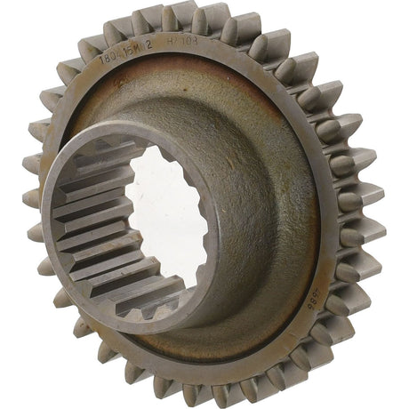 Close-up of the Sparex Pinion Gear | Sparex Part No.S.40762, featuring interlocking teeth and a hollow core with internal grooves. This cylindrical gear has a rugged, industrial appearance reminiscent of Massey Ferguson machinery.