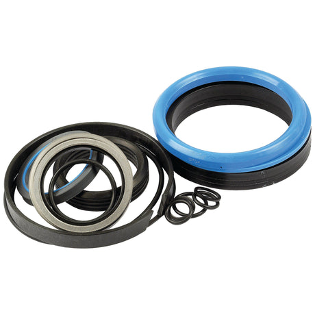 A variety of seals and gaskets, including blue rubber, black rubber, and metal rings, arranged on a white background—ideal for Massey Ferguson 50B repairs. For ultimate convenience and reliability, consider the Seal Kit (Boom Ram) by Sparex (Part No. S.41275).