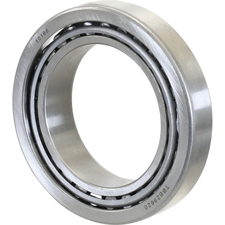 A Sparex Taper Roller Bearing (29685/29620) - S.41455 with a hollow center and visible markings on the outer ring, compatible with Ford/New Holland machinery.