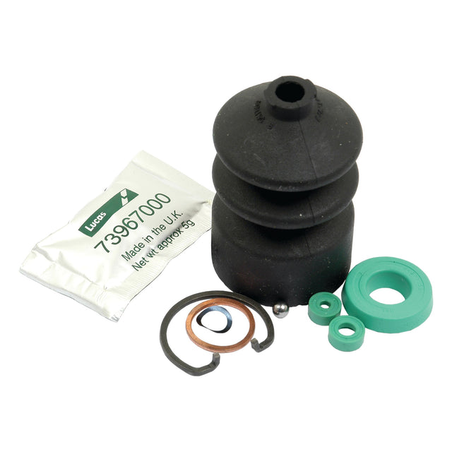 The Sparex Brake Master Cylinder Repair Kit (Sparex Part No. S.42031) features a collection of automotive components, including a black rubber boot, various seals, a metal ring, and a packet labeled "Lucas 73967000 Made in the UK," ideal for maintaining your Massey Ferguson or Brake Master Cylinder.