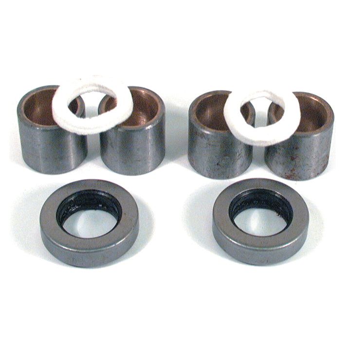 Metal bushings and rubber seals, part of the Spindle Repair Kit (Sparex Part No. S.42040) for Massey Ferguson, are arranged on a white background.