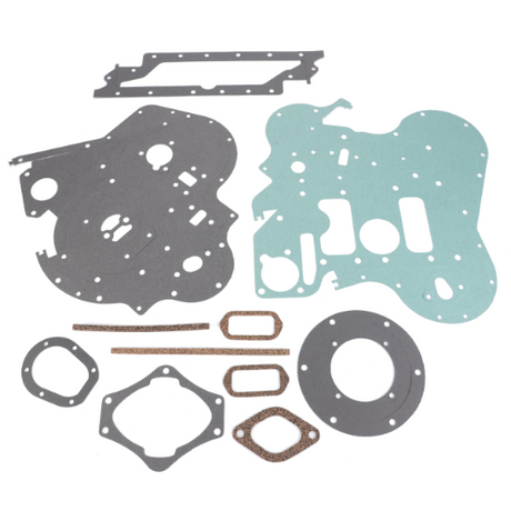 A collection of AGCO Massey Ferguson Sump Gasket Kit (part number 4224142M91) components arranged on a white background. The gaskets come in various shapes and sizes, crafted from different materials, essential for maintaining your Massey Ferguson tractor parts.