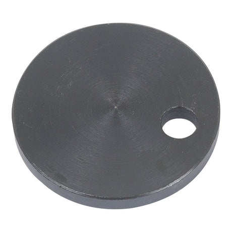 Draft Control Disc by Sparex, Part No. S.42302, is a circular metal disc with a smooth surface and a single small hole near the edge, ideal for use in Massey Ferguson machinery or as part of your Sparex collection.