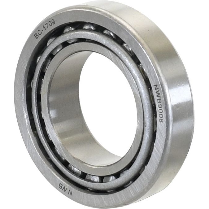 Close-up of a cylindrical metal ball bearing with internal rolling elements, featuring engraved markings "BC-1709" and "NWB90008", resembling the precision of a Sparex Taper Roller Bearing (LM501349/501310) - S.4235, typically seen in Case IH or International Harvester machinery.