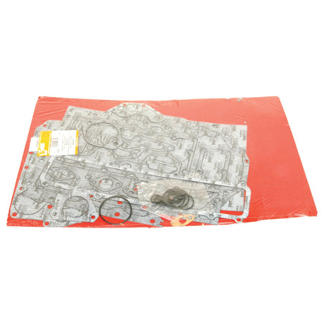 A package containing multiple gaskets and small rubber O-rings for a Perkins Engine Model, set against a red background. Product: Bottom Gasket Set - 6 Cyl. (1006.6, 1006.60T, A6.354.4) | Sparex Part No.S.42398 by the brand Sparex.