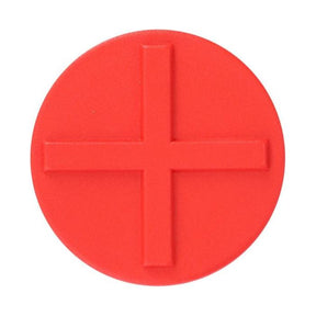 Image of a red circular object with an embossed, raised plus sign in the center, reminiscent of the design elements found in the Massey Ferguson - Padding - 4270214M1 by AGCO.