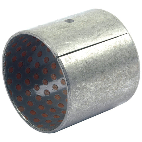 A Sparex Bush (Part No. S.43334), featuring a slightly worn, perforated interior surface and a small notch on the outer side, that is compatible with Massey Ferguson models.