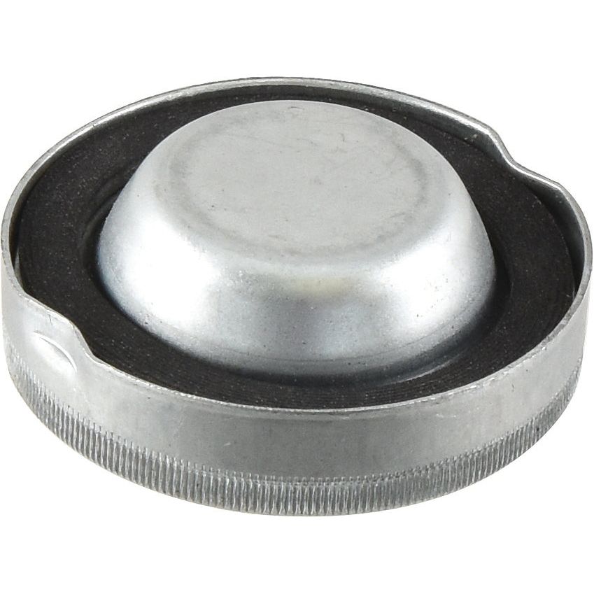 A metal cap with a round, raised center and a knurled edge, shown against a plain white background. This Sparex Engine Oil Cap (Part No. S.43732), compatible with models like Massey Ferguson and Landini 7830, ensures a secure fit and reliable performance.