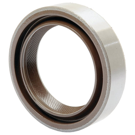 A close-up of the Sparex Oil Seal 1.75'' x 2.5'' x 0.55'', often used in Massey Ferguson tractors, featuring an inner and outer ring with a distinctive grooved pattern on the inner surface.