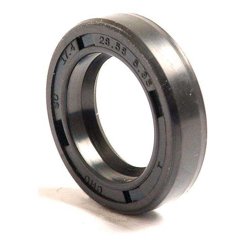 Close-up of a black rubber oil seal, identified as a Sparex Imperial Rotary Shaft Seal (Sparex Part No. S.4433), with the dimensions 11/16'' x 1 1/8'' x 1/4'' imprinted on its surface.