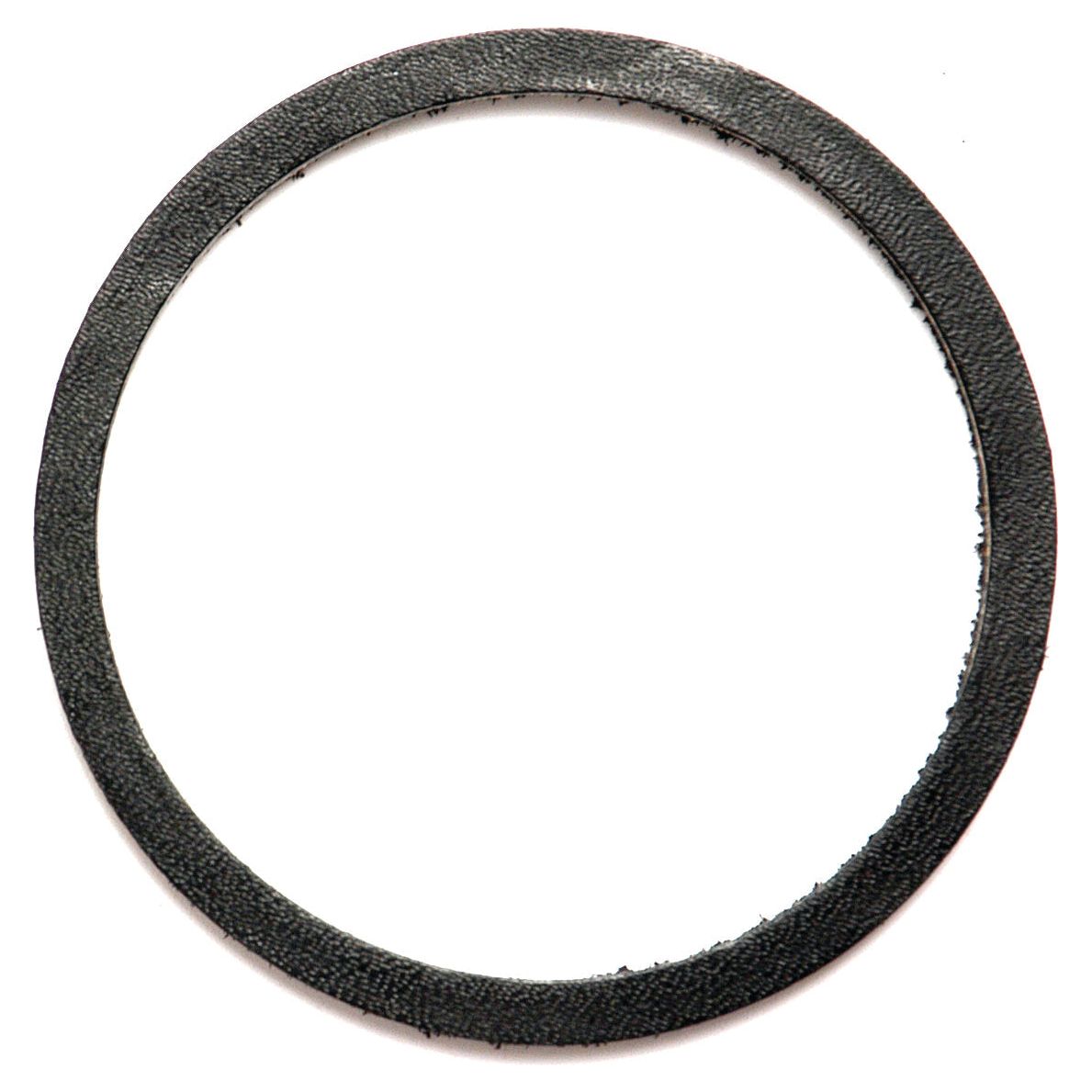 A close-up of a black, circular gasket with a textured surface, closely resembling the rugged construction of a Ford/New Holland oil seal, specifically Sparex Part No. S.4584 (67 x 76 x 3mm).