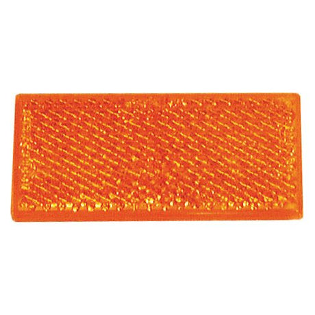 The Sparex Rectangular Reflector (Self Adhesive) Amber 4 pcs. Agripak, part number S.4612, features a textured surface and includes a self-adhesive backing for easy application.