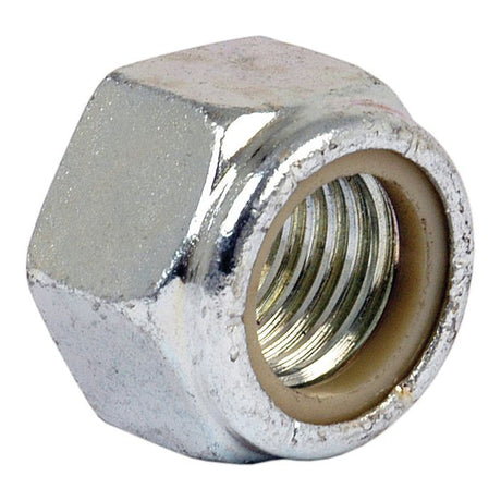 Close-up of a Sparex Imperial Self Locking Nut (1" UNC, DIN 985) with threading visible inside, featuring a hexagonal design and Zinc Plated finish.