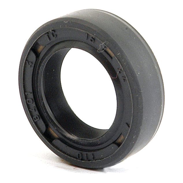 Close-up of a Sparex black rubber Metric Rotary Shaft Seal, 15 x 24 x 7mm Double Lip (Sparex Part No. S.50160) with engraved markings on its surface, typically used in machinery for protecting against contamination and leakage. This double lip seal ensures optimal performance in demanding environments.