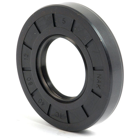 Close-up of a black rubber oil seal with embossed alphanumeric markings "NAK TC 12 30 40." The central hole allows for mechanical fitting. This Sparex Metric Rotary Shaft Seal, 40 x 80 x 13mm Double Lip (Sparex Part No. S.50331), features a ribbed outer surface for secure placement.