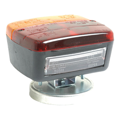 A rectangular, dual-color (orange and red) Sparex Rear Combination Light with a clear polycarbonate lens, mounted on a metal base with a magnetic fixing mechanism. This 12V halogen light serves three functions: brake, tail, and indicator, suitable for both right hand and left hand installation - S.51748.