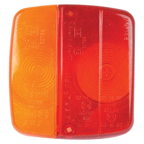 Close-up of the Sparex rectangular vehicle rear light with amber and red sections. The Replacement Lens, compatible with S.51760, S.51748, S.51749, S.5004 & S.5003 models (Sparex Part No.S.51761), features circular ridges and embossed text markings indicating specifications, crafted from durable polycarbonate.
