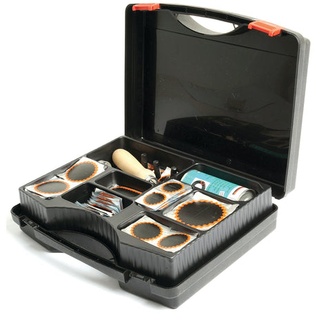 A black plastic case containing the Sparex Tyre Repair Kit TT40 (Sparex Part No. S.52215), including patches, vulcanising fluid, and a wooden-handled tool.