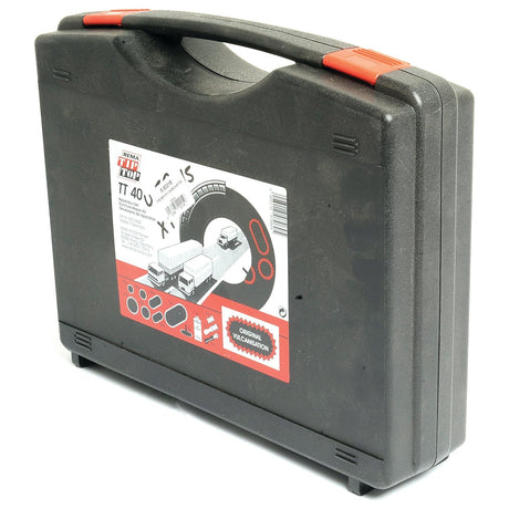 The Tyre Repair Kit TT40 from Sparex (Part No. S.52215) comes in a black plastic carry case with a handle. The case features a sticker displaying images of trucks, tires, and various tools, along with the "TIP TOP TT 40" label in red and white. This compact kit includes everything you need for tyre repairs, from vulcanising fluid to essential repair tools.