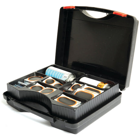 A black plastic case open to reveal a Sparex Tyre Repair Kit TT42 for bicycles, containing patches, adhesive, vulcanising fluid, and other tools.