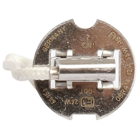 Close-up of a small, round, metallic component with a white cord attached, resembling a Sparex H3 halogen light bulb. It has engravings indicating "Germany," "12V," "55W," and "PK22s.