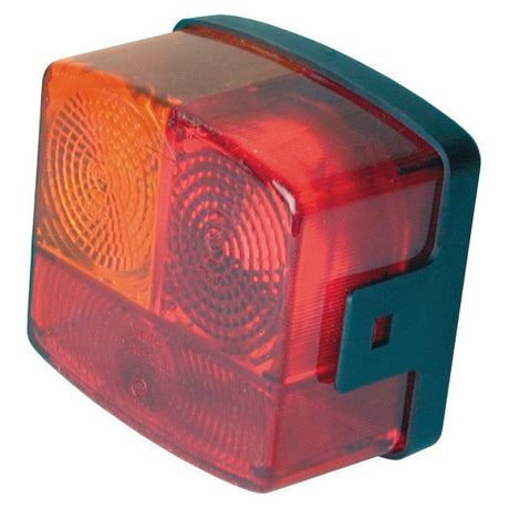 A close-up view of the Sparex Halogen Rear Combination Light 12/24V, LH (S.56081) featuring red and amber sections with a black mounting bracket and Hella-compatible design.