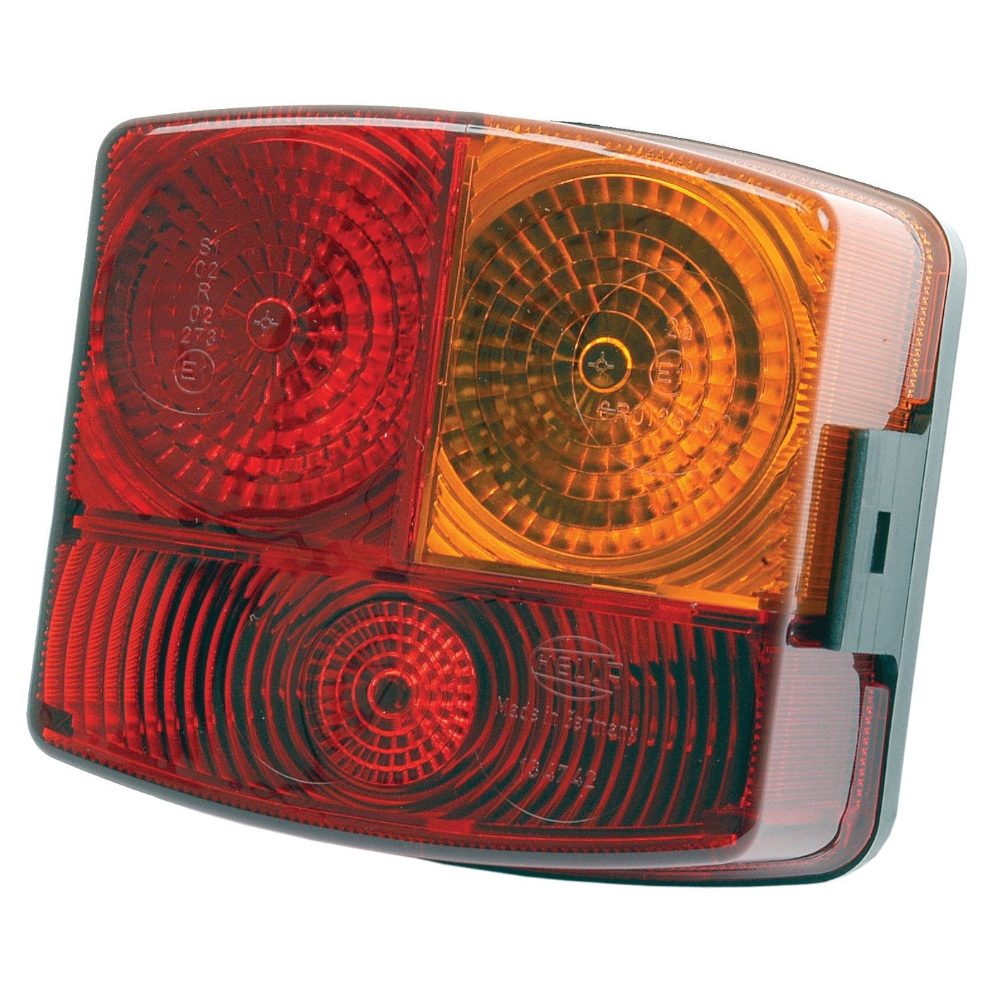 Close-up of the Sparex Halogen Rear Combination Light 12/24V, RH - S.56082 showing red, amber, and white sections with circular patterns, crafted from durable plastic compounds.