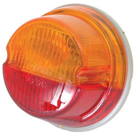 Introducing the Sparex Rear Combination Light (Halogen), designed to offer a dual-color illumination with an amber top half and a red bottom half. This circular light features a distinctive white rim, ridged texture, and a durable polycarbonate lens. Suitable for both right-hand and left-hand application, it operates at 12V and ensures reliable two-function performance.