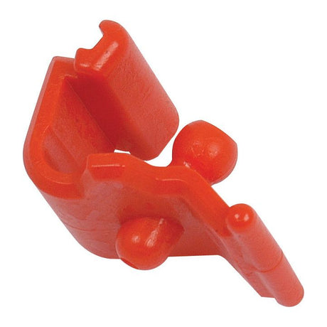 Close-up of a Sparex red plastic clamp, part number S.56509, with a simple, angular design featuring two small protruding knobs, a rectangular opening, and the reliable PTO GREASE NIPPLE LOCK mechanism.