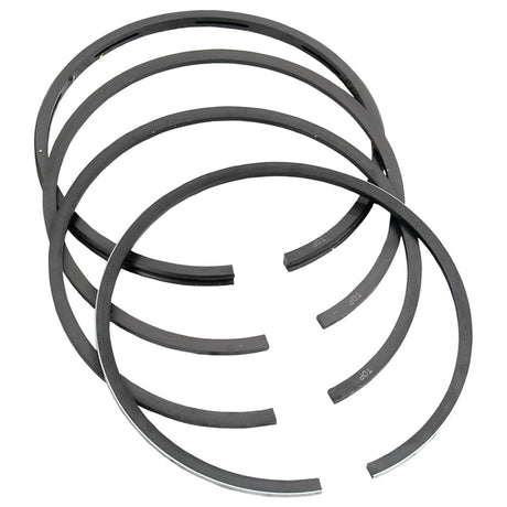 A set of four Sparex Piston Rings +0.020'' (0.50mm), part number S.57509, chrome-plated metal rings arranged in a slightly overlapping stack against a plain white background.