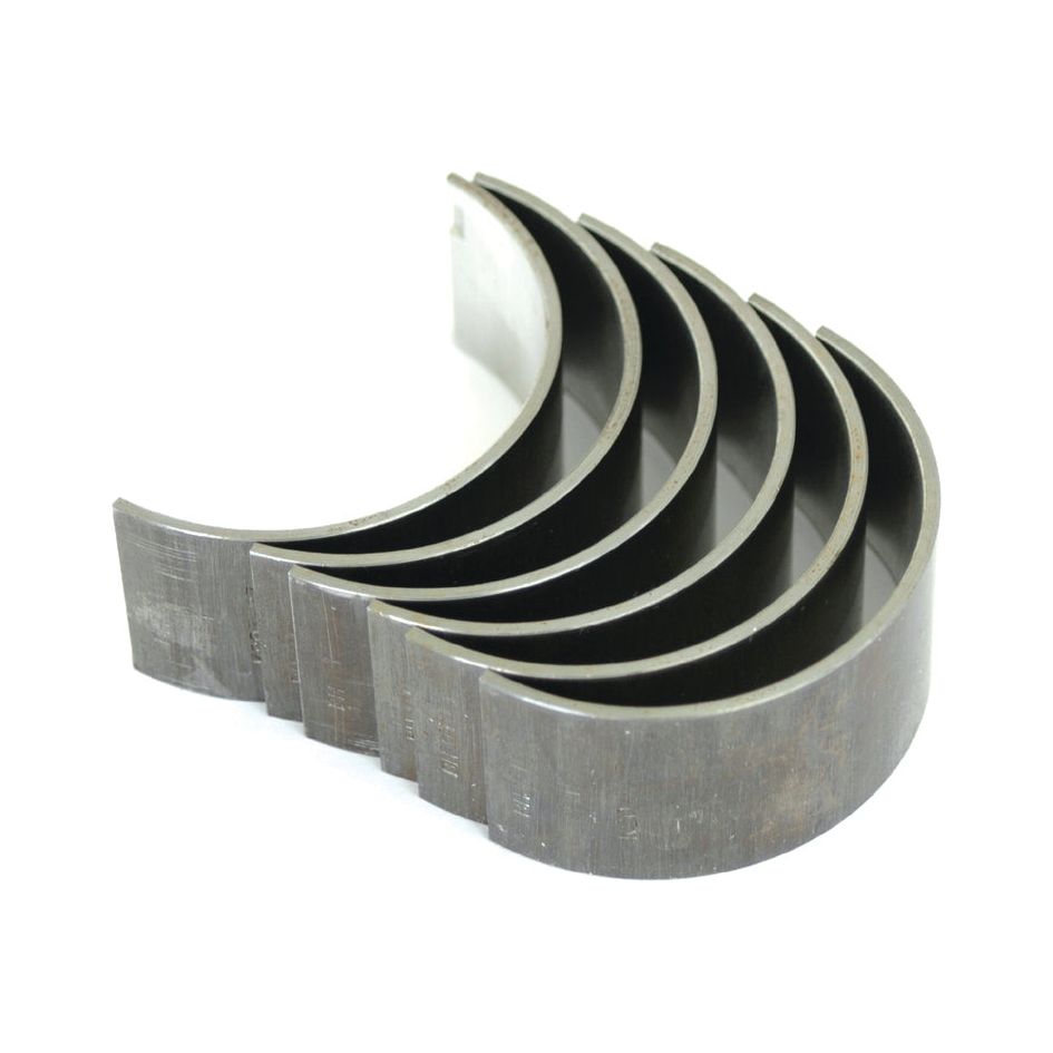 Image shows six Sparex Conrod Bearing +0.010'' (0.25mm) Set (Sparex Part No.S.57518) metal engine bearings arranged in a staggered, aligned pattern on a white background, suitable for Ford / New Holland or Case IH / International Harvester machinery.